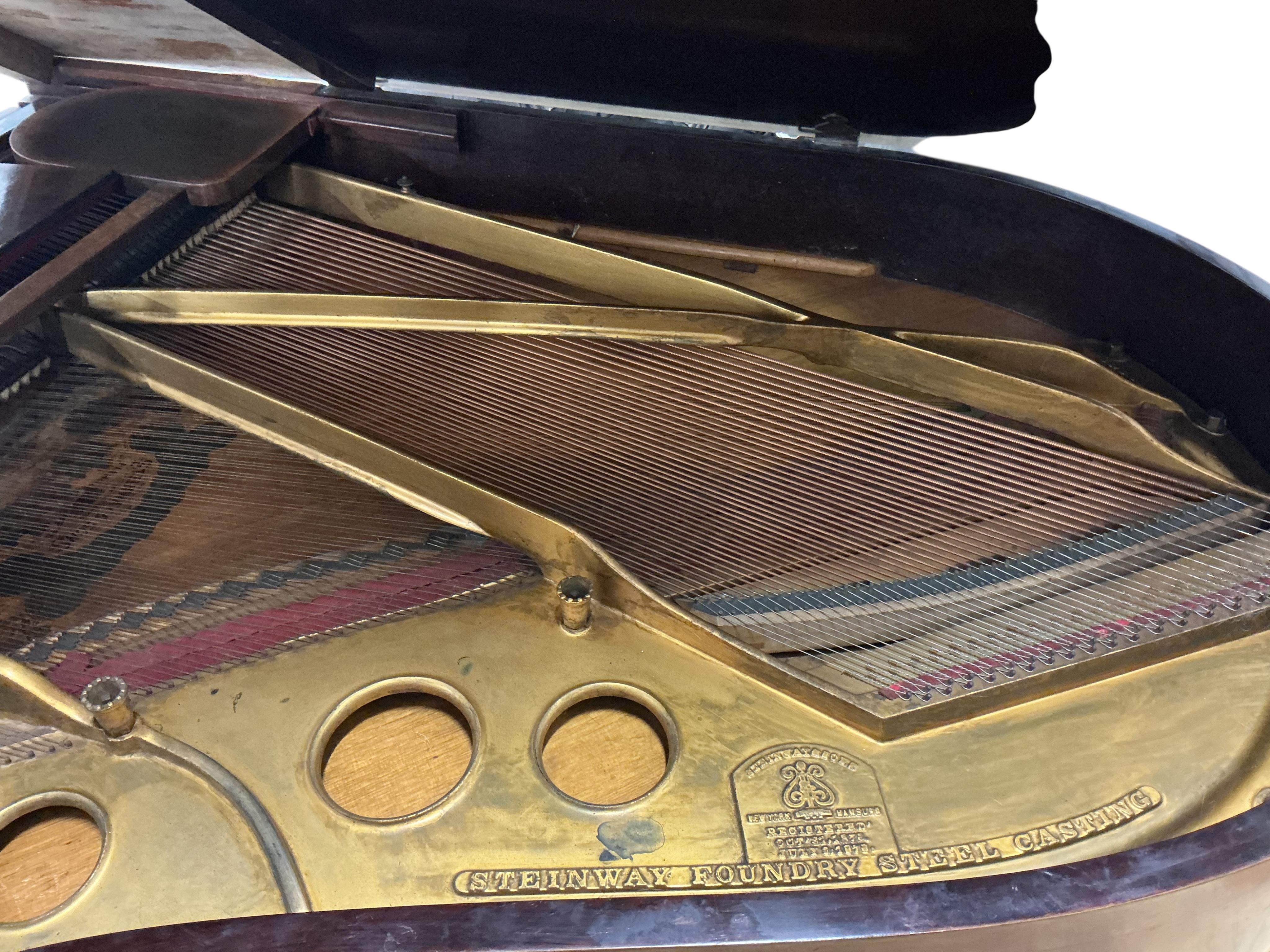 A Steinway rosewood grand piano, length 180cm, width 143cm, height 98cm CITES Submission reference QSWF2A3L